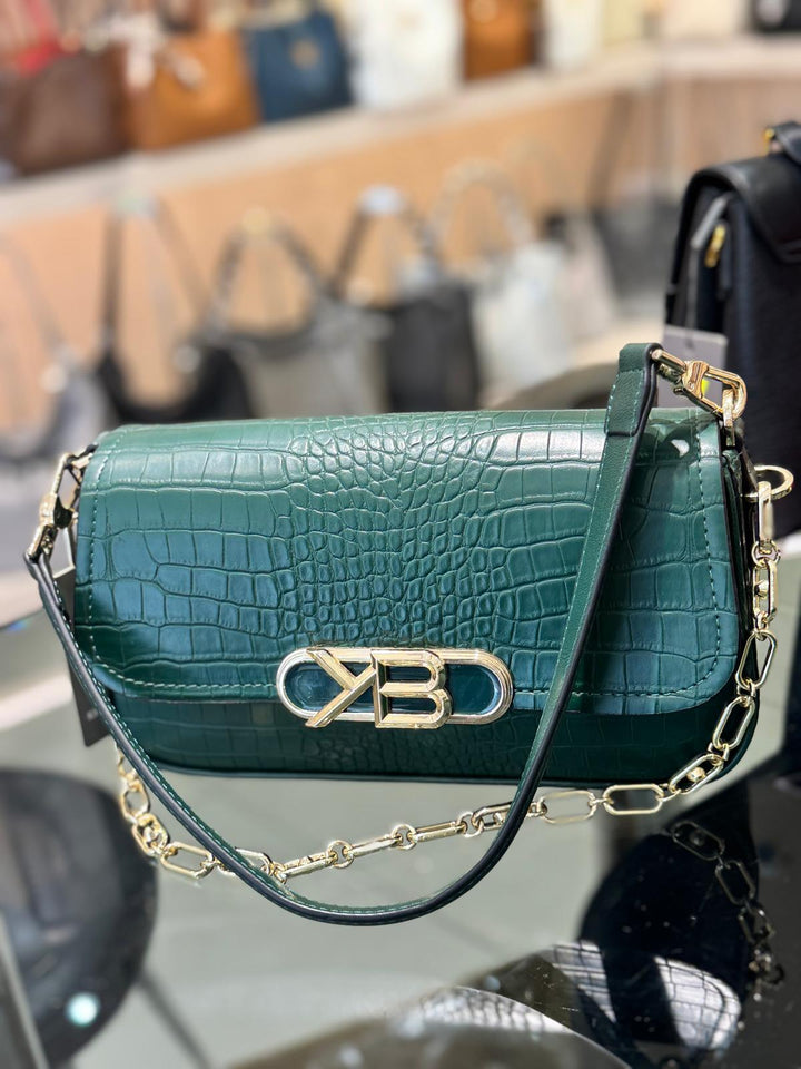Green crocodile-patterned handbag