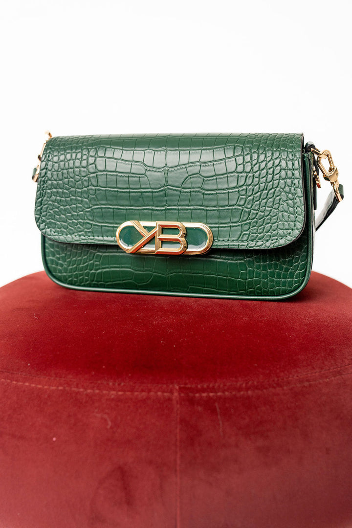 Green crocodile-patterned handbag