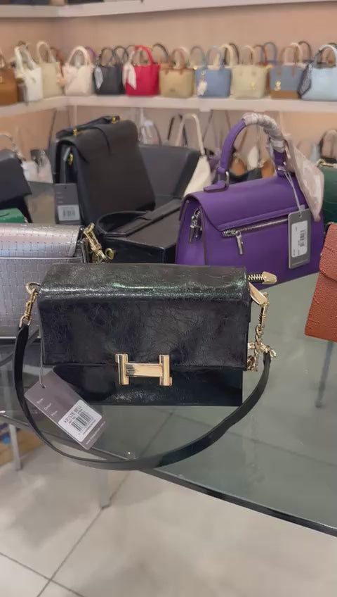 Navy blue handbag with gold clasp