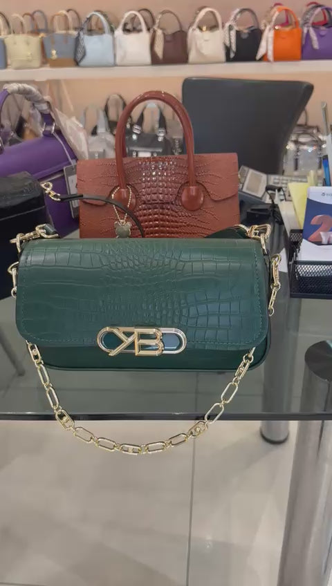 Green crocodile-patterned handbag
