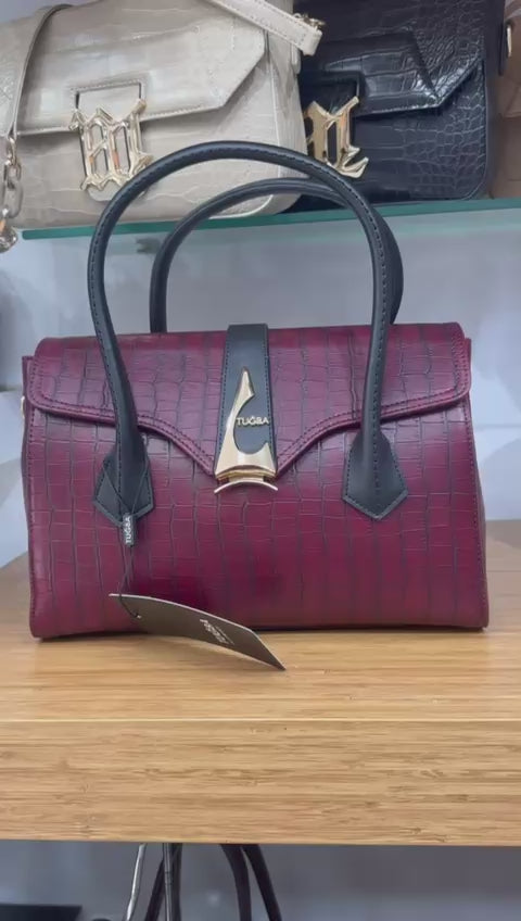 Red handbag with black handles